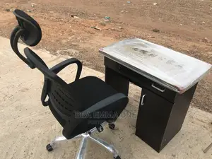 Brand New Office Chair With Neck Rest and a Table