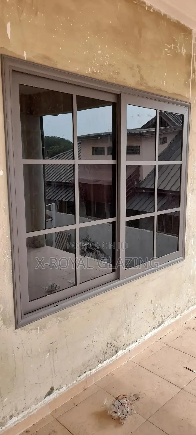 Gray Powdered Divisions Sliding Windows With Dark Glass