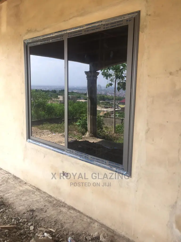 Grey Italian Sliding Window and Dark Glass