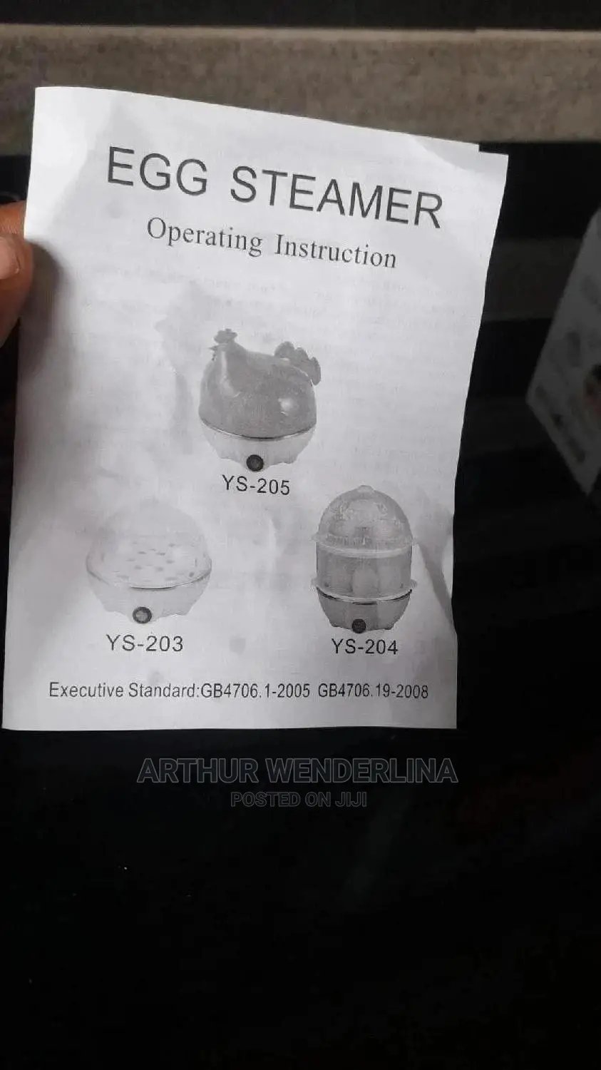 Electric Egg Cooker Used for Boiling and Frying Egg.