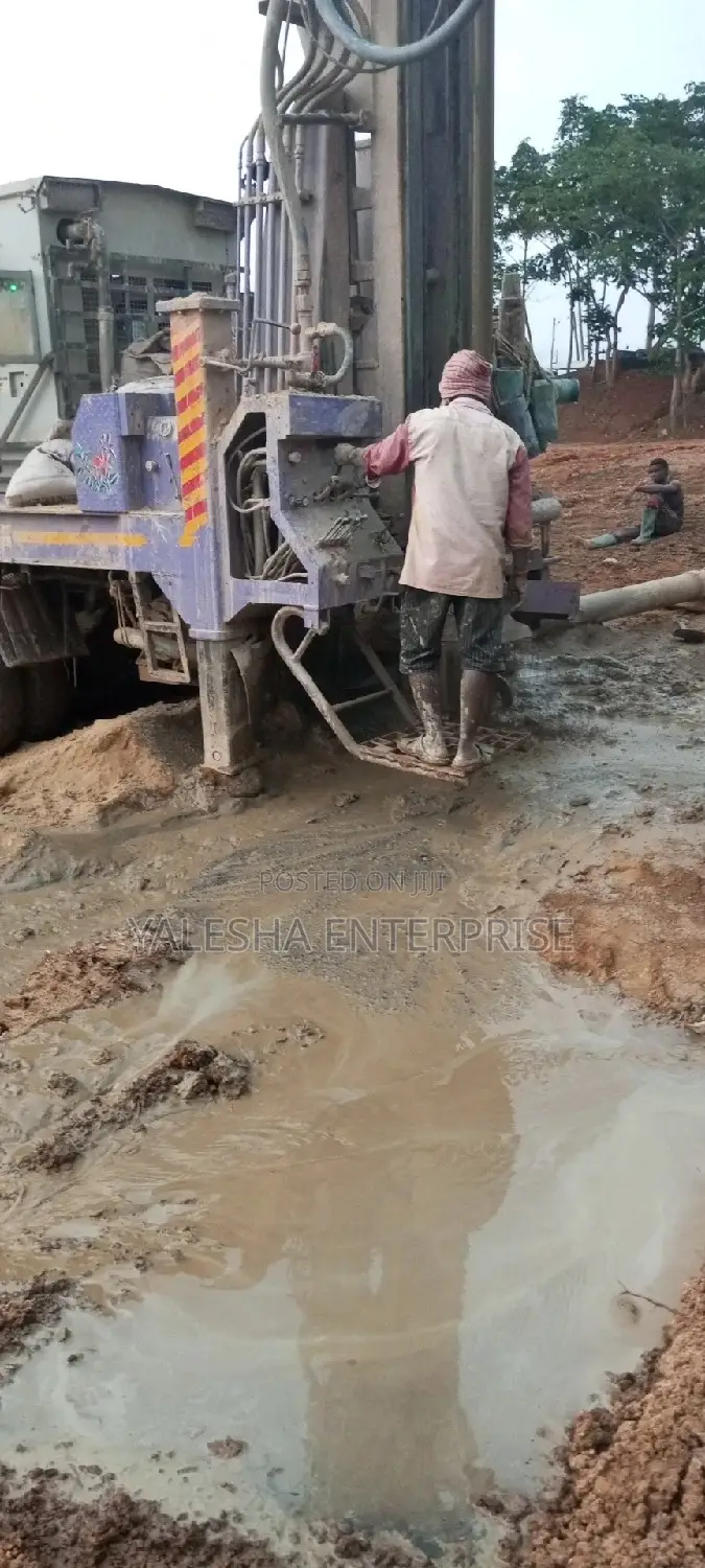 Borehole Drilling Services With Quality Pump and Blue Pipes
