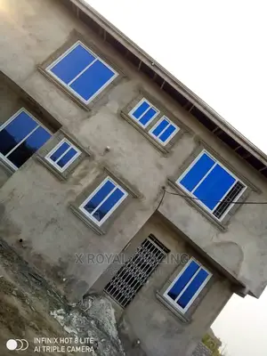 White Italian Frame Sliding Windows With Blue Glass.
