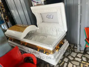 Proudly Made in Ghana Casket Gold Handles and White Interior