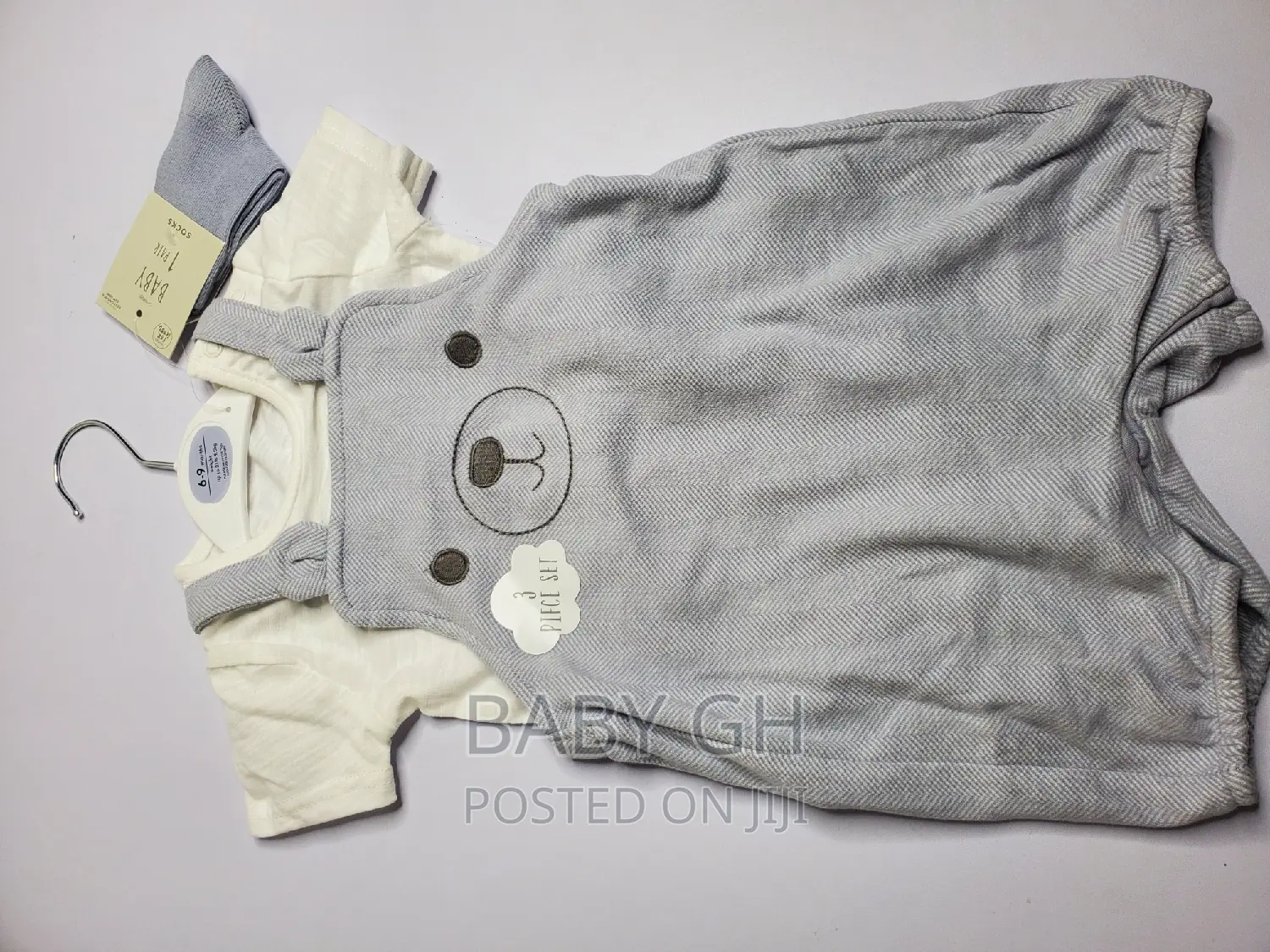 Goerge Baby Brace Jumper and White Top With a Pair of Socks
