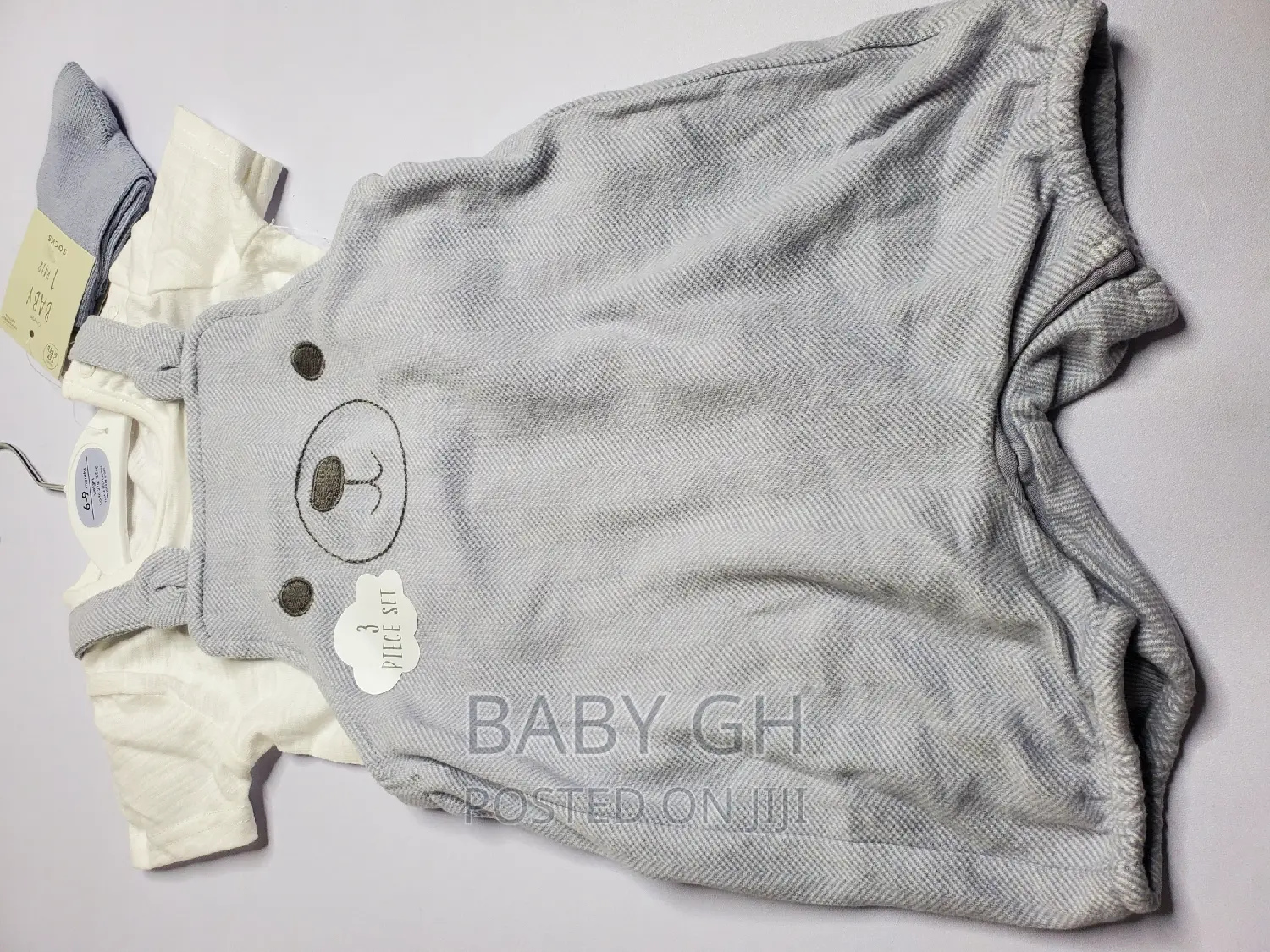 Goerge Baby Brace Jumper and White Top With a Pair of Socks