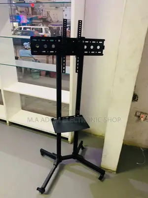 Photo - Purchase Classic Moveable Tv Trolly for 32”-65 Inch.