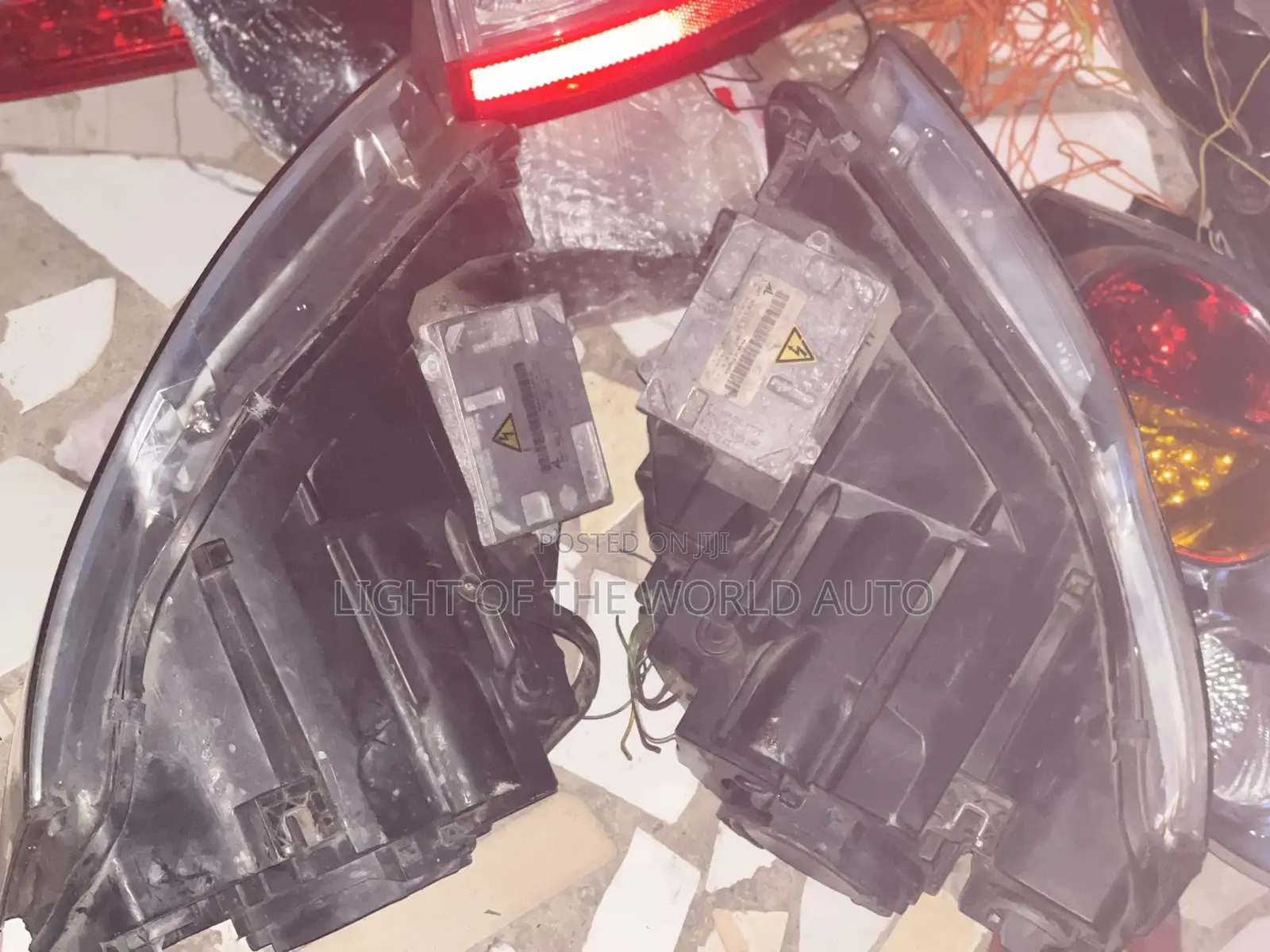 Audi A4 2005 Headlight With Charger Booster on It