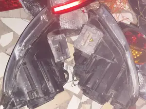 Audi A4 2005 Headlight With Charger Booster on It