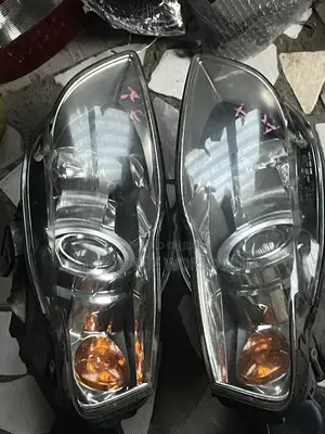 Audi A4 2005 Headlight With Charger Booster on It