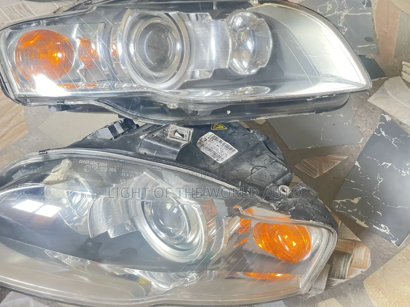 Audi A4 2005 Headlight With Charger Booster on It