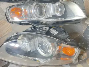 Audi A4 2005 Headlight With Charger Booster on It
