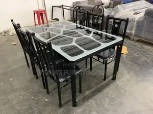A Dining Table With 6 Chairs ( Glass )