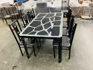 A Dining Table With 6 Chairs ( Glass )