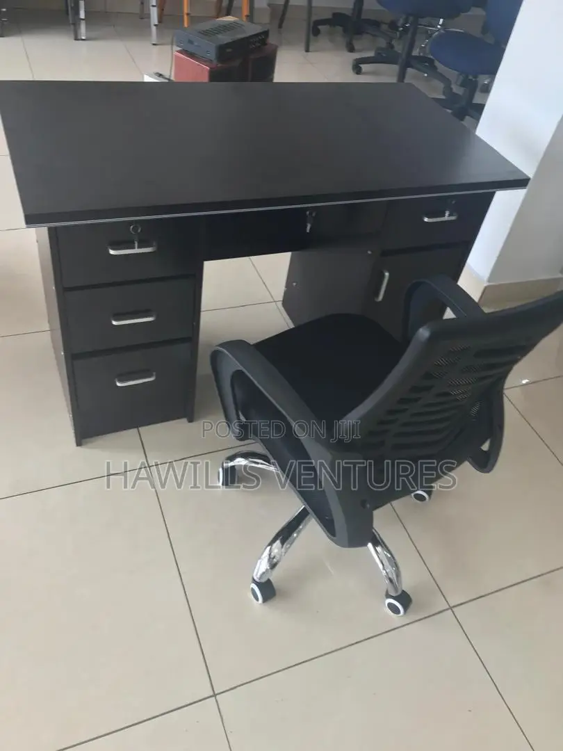 A Set of Office Table With Office Chair Headrest.