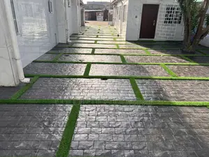 Cobbles Stamped Concrete With Astroturf
