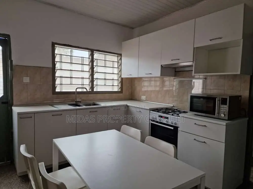 98x100ft Land With a House for Sale at Adenta Village