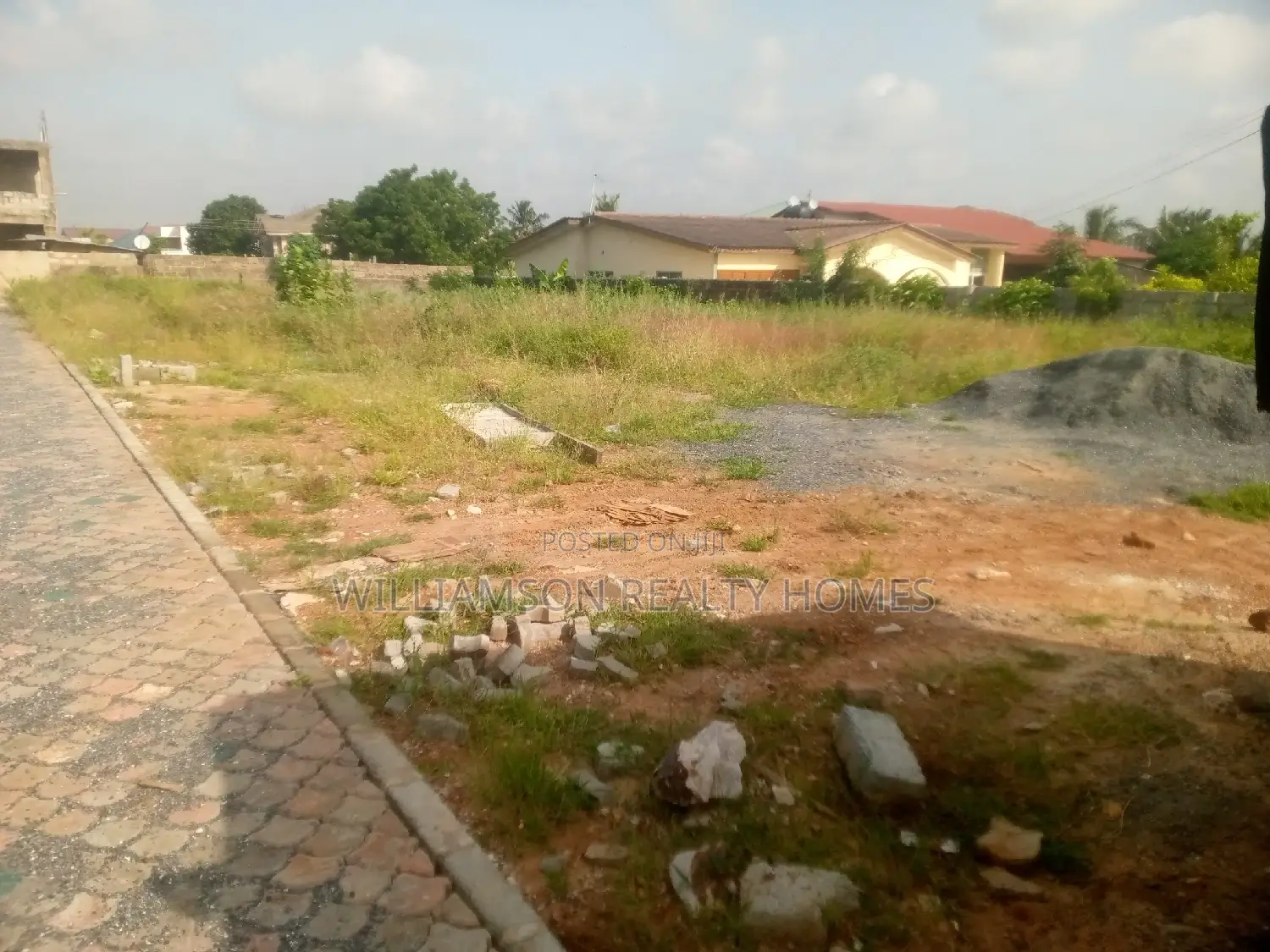Titled Road Side Walled and Gated Land for Sale,Spintex