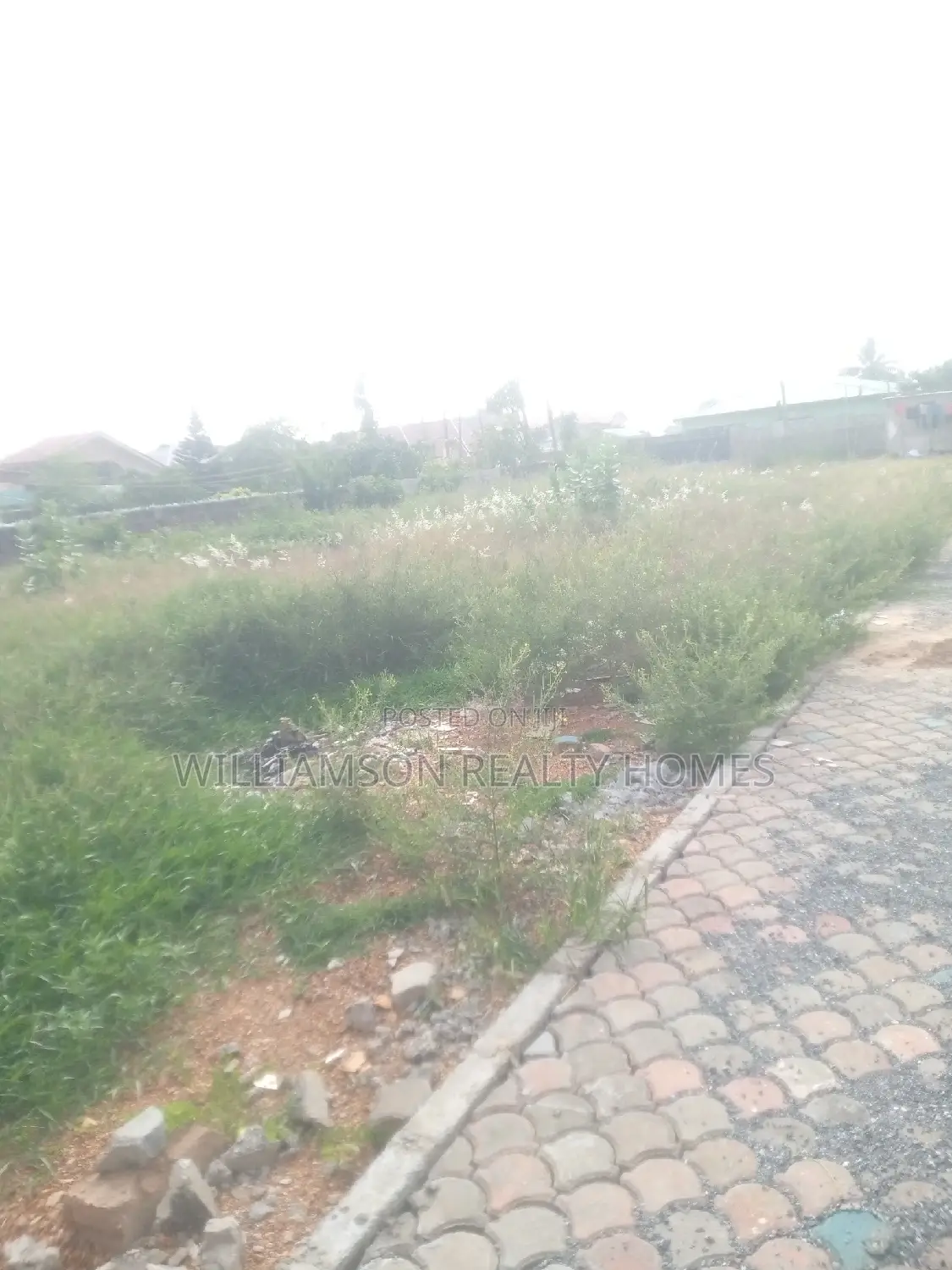 Titled Road Side Walled and Gated Land for Sale,Spintex