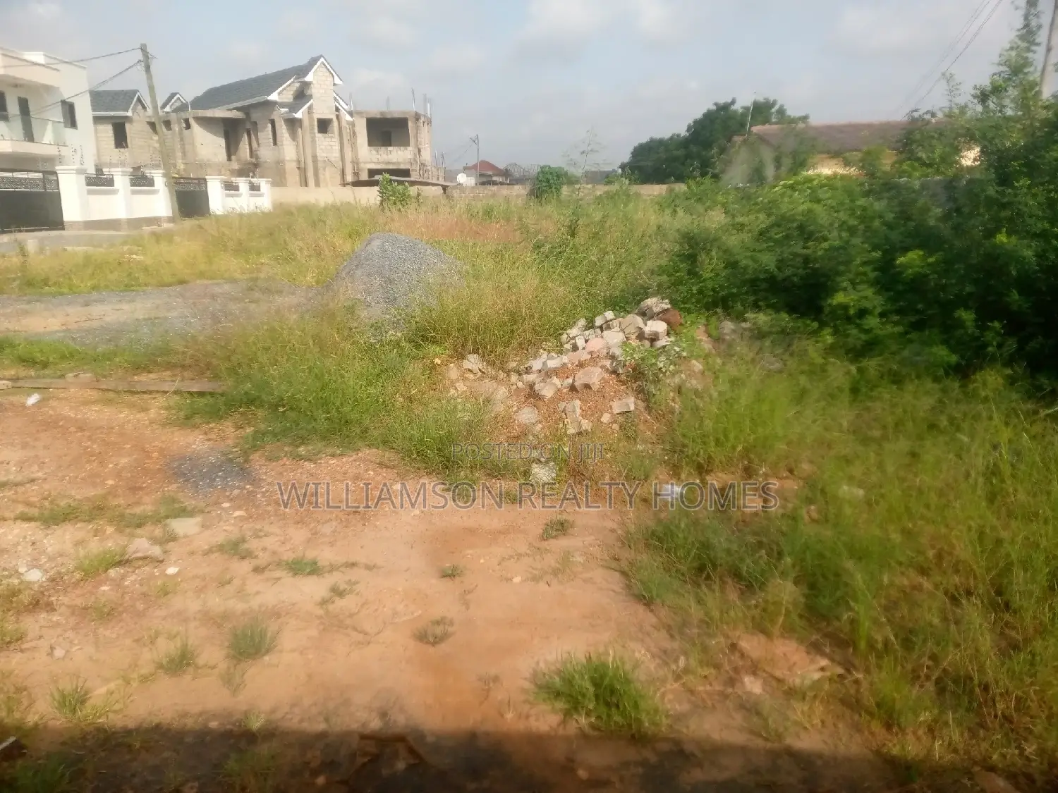 Titled Road Side Walled and Gated Land for Sale,Spintex