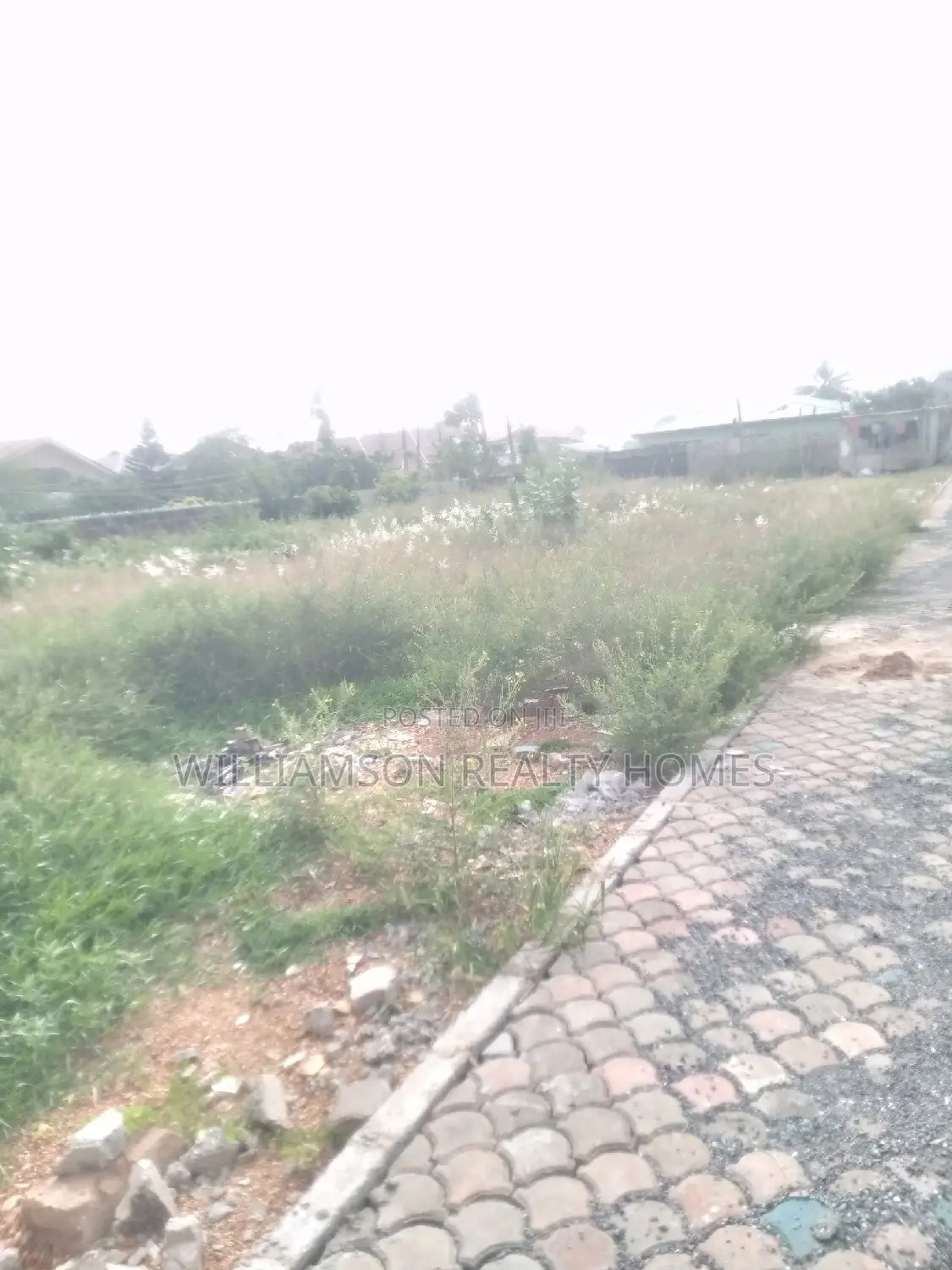 Titled Road Side Walled and Gated Land for Sale,Spintex