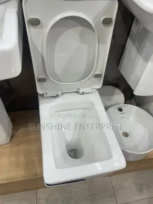 Black and White Water Closet With Wash Hand Basin and Stand