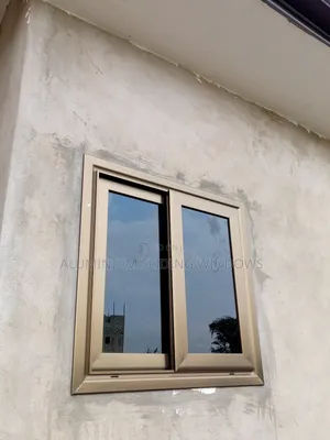 Aluminium Sliding Windows With Dark Tinted Glass and Net