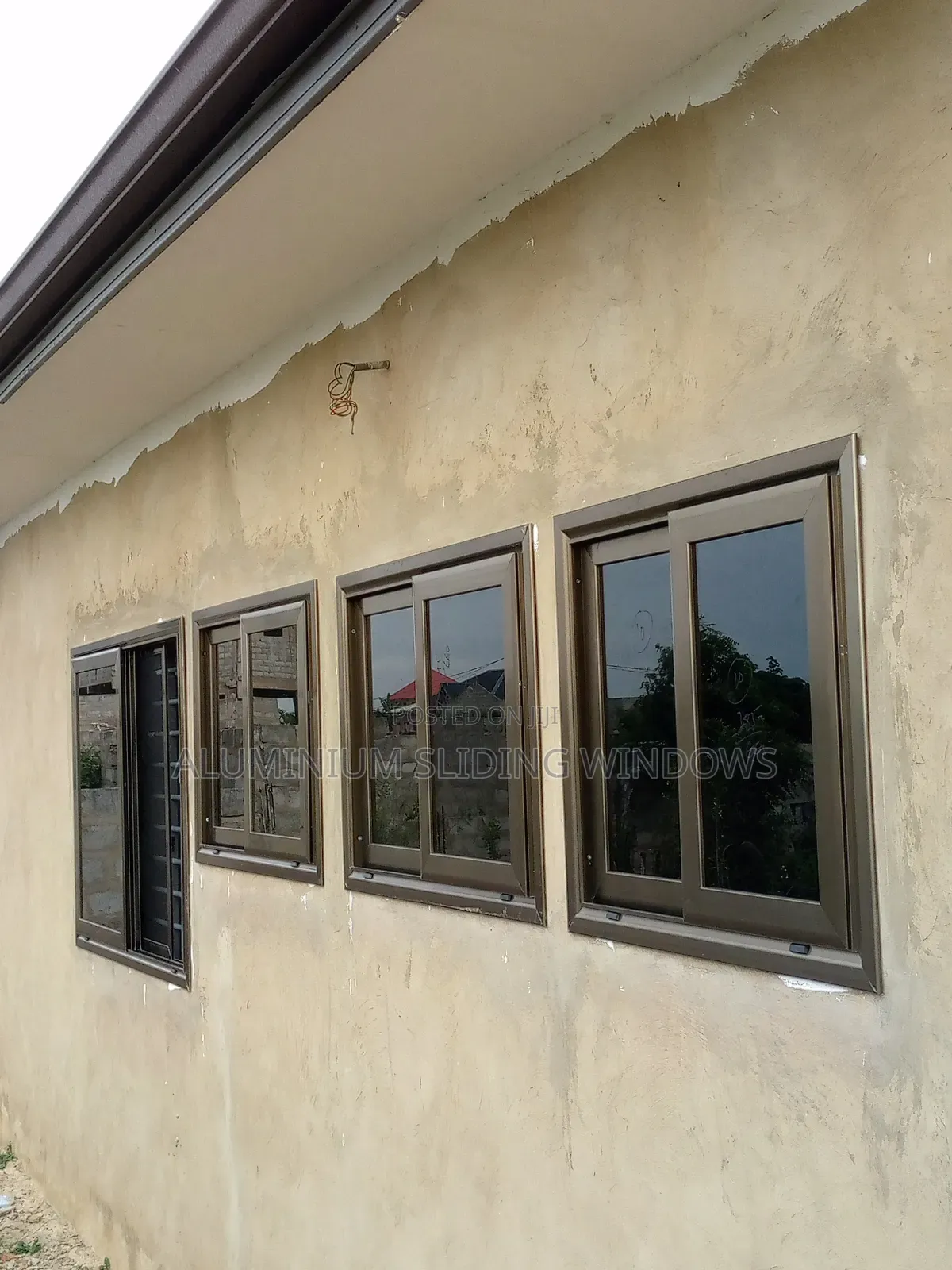Aluminium Sliding Windows With Dark Tinted Glass and Net