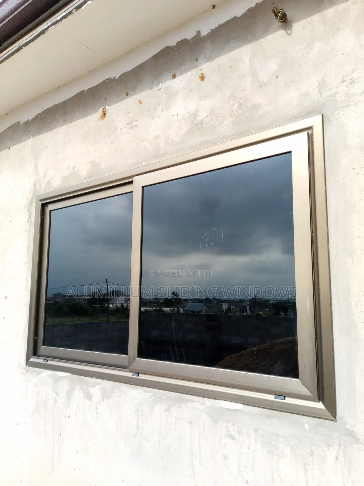 Aluminium Sliding Windows With Dark Tinted Glass and Net