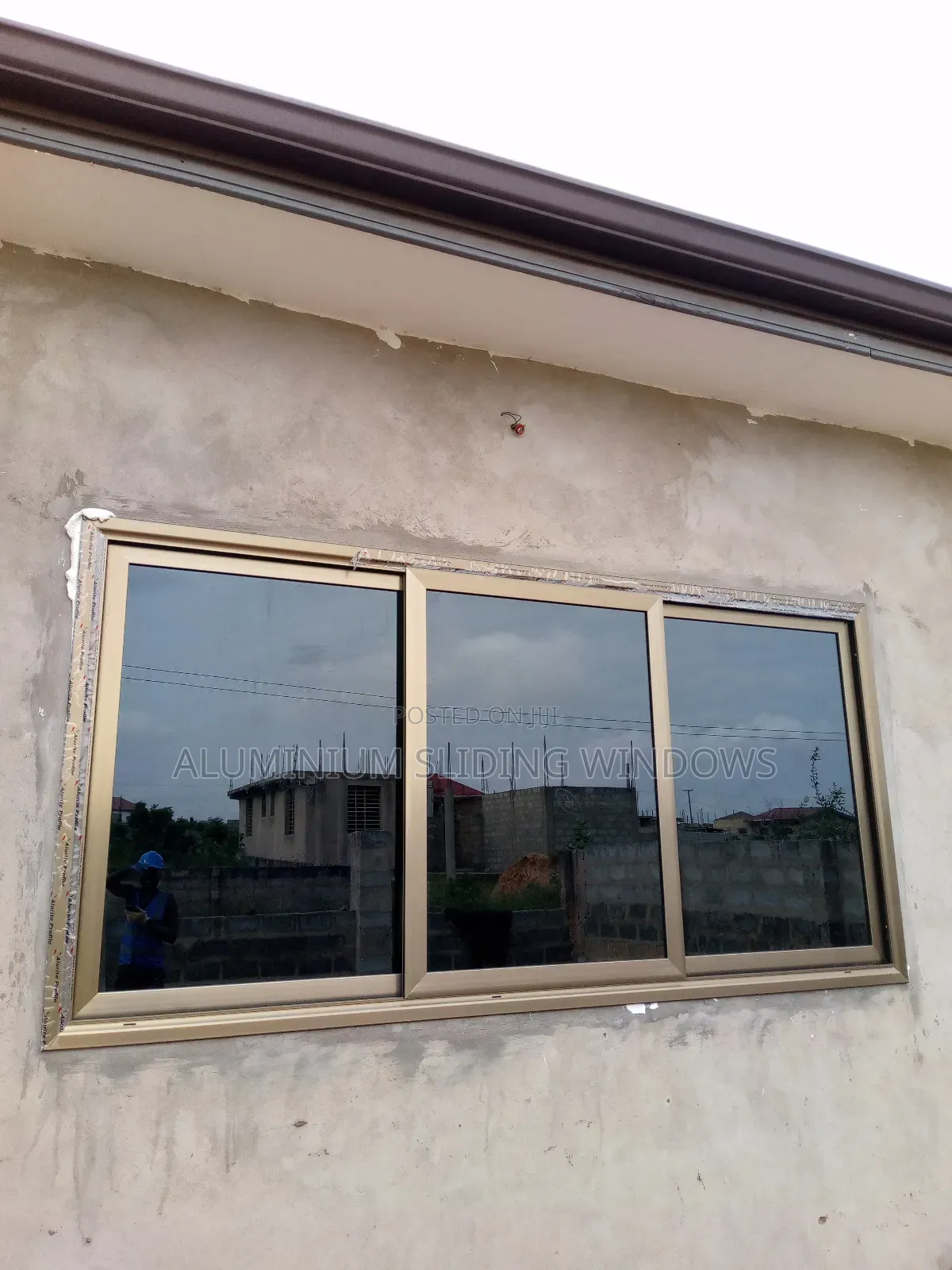 Aluminium Sliding Windows With Dark Tinted Glass and Net
