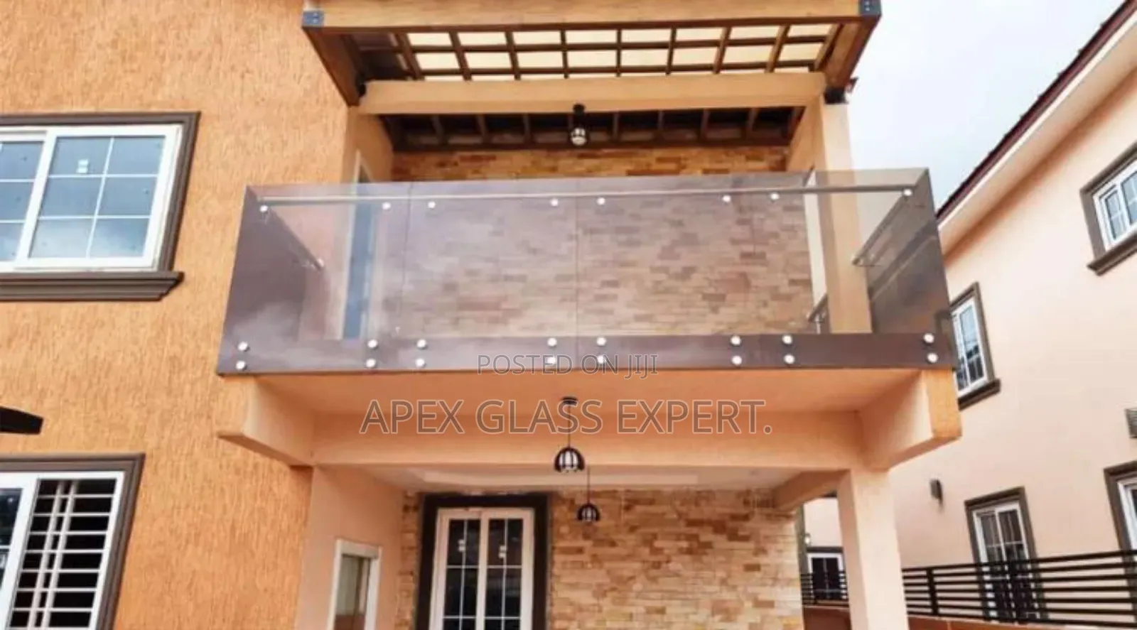 Bolted System Balustrade With Railing Support by Apex Glass.
