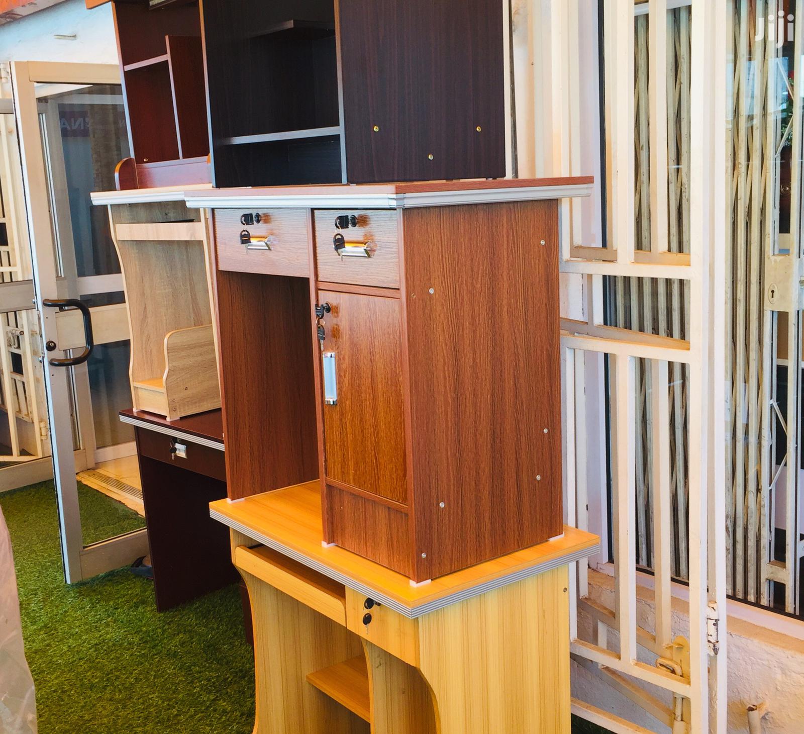 Conpact Wooden Desk Features Two Drawers and a Locking Cabinet.