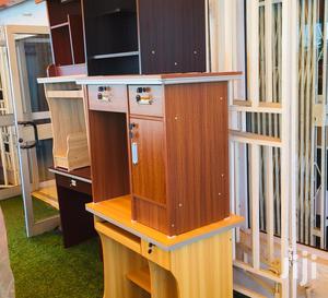 Conpact Wooden Desk Features Two Drawers and a Locking Cabinet.