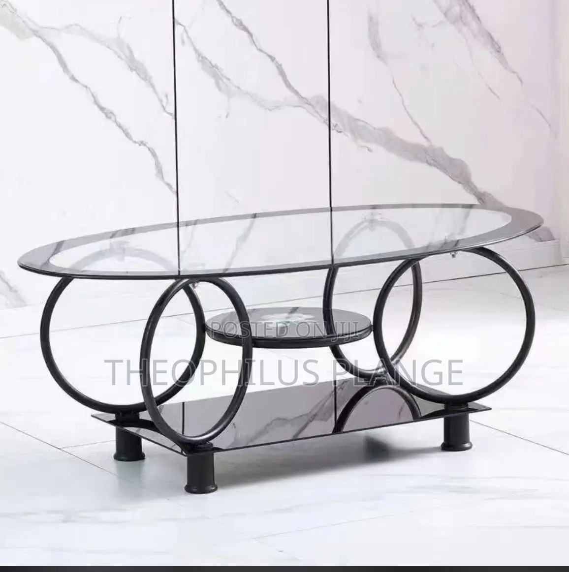 Glass Center Table With Round Base Design.