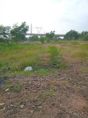 9 Acrs of Land at Pokuase Just by the Road for Sale