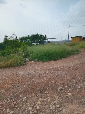 9 Acrs of Land at Pokuase Just by the Road for Sale