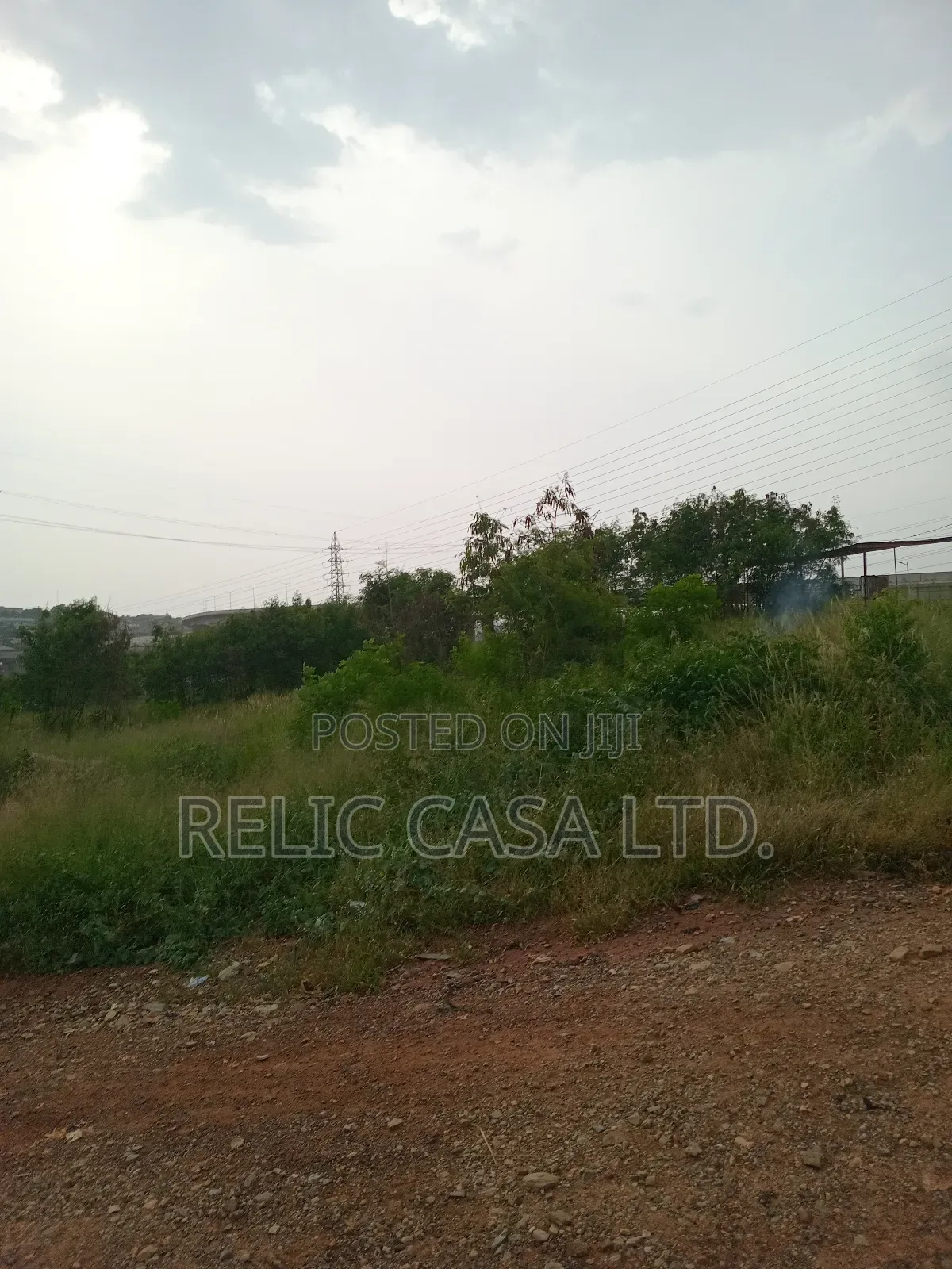 9 Acrs of Land at Pokuase Just by the Road for Sale