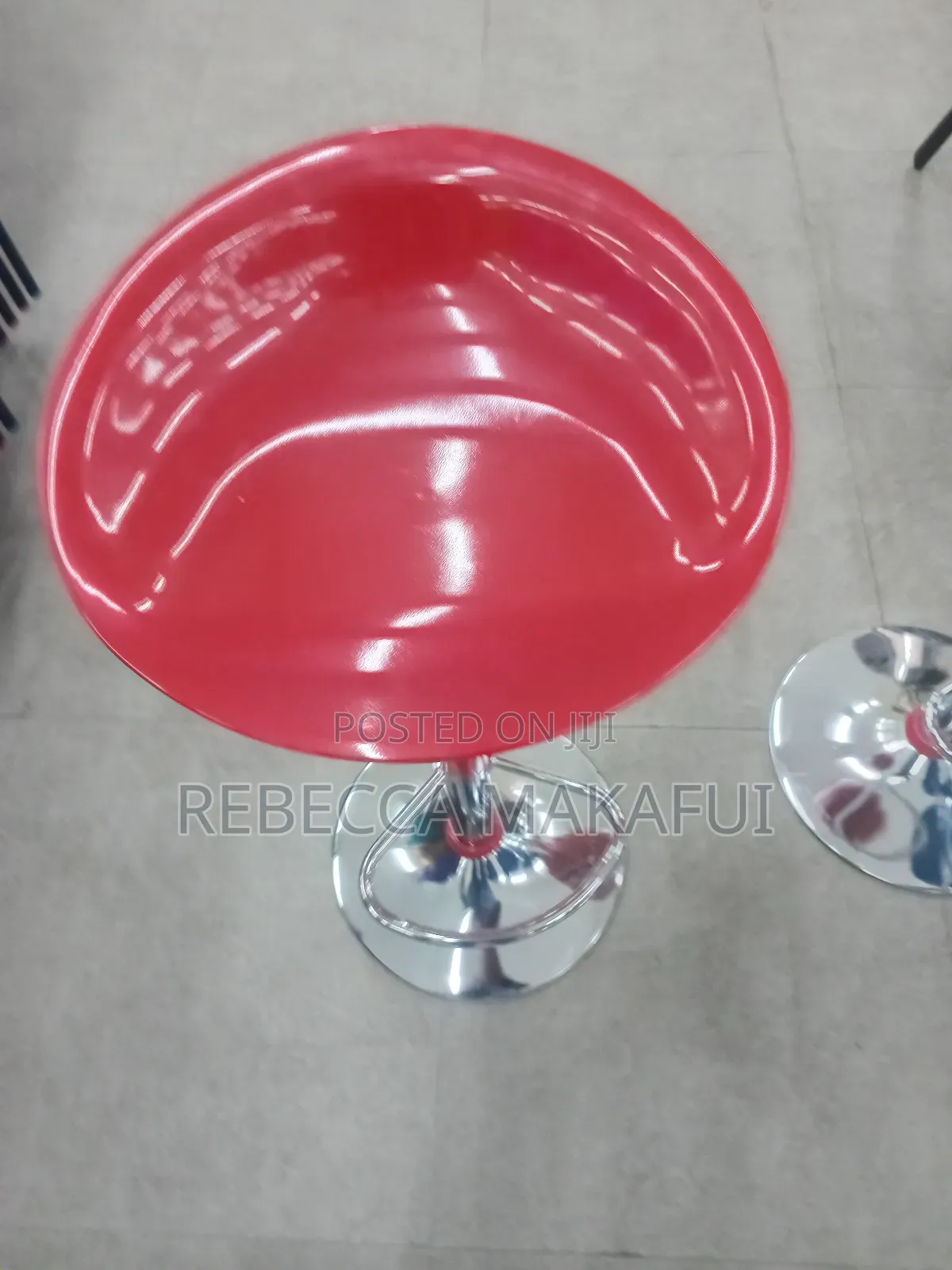 Red Bar Stool With Silver Base and Footrest .