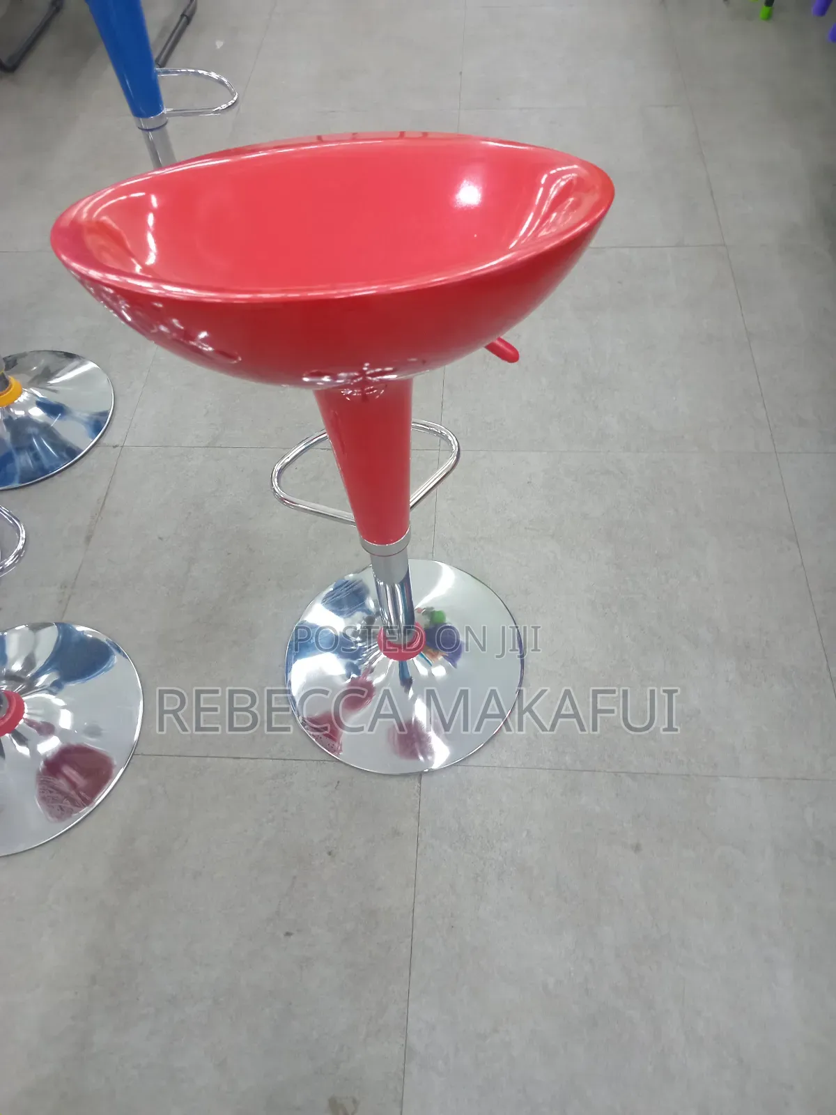 Red Bar Stool With Silver Base and Footrest .