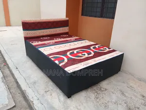 Gucci on Black Bed.