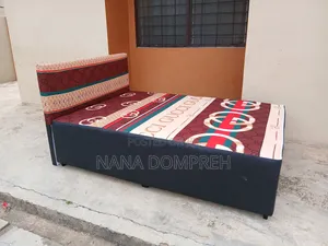 Gucci on Black Bed.
