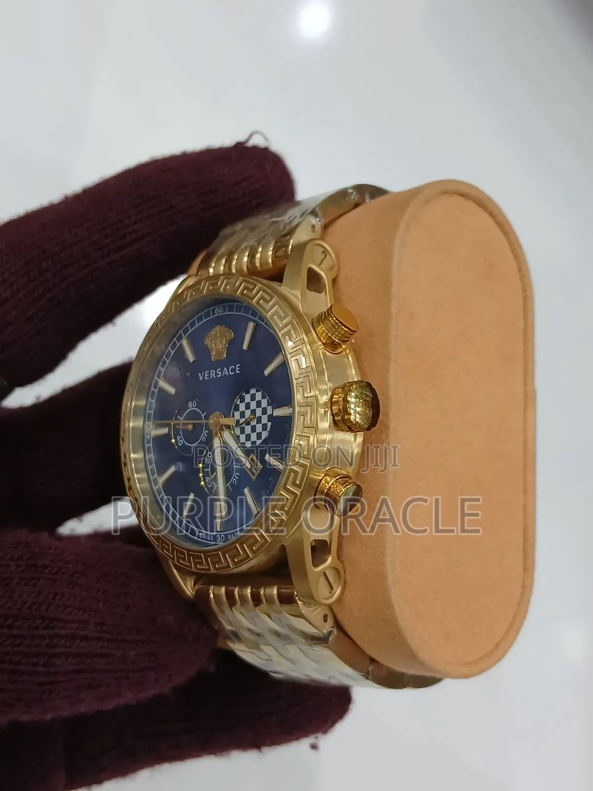 Gold and Silver Versace Men's Watch With a Blue Face.