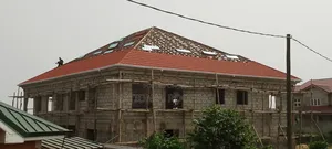 Installation of Rain Gutter and Stone Coated Roofing Sheet.