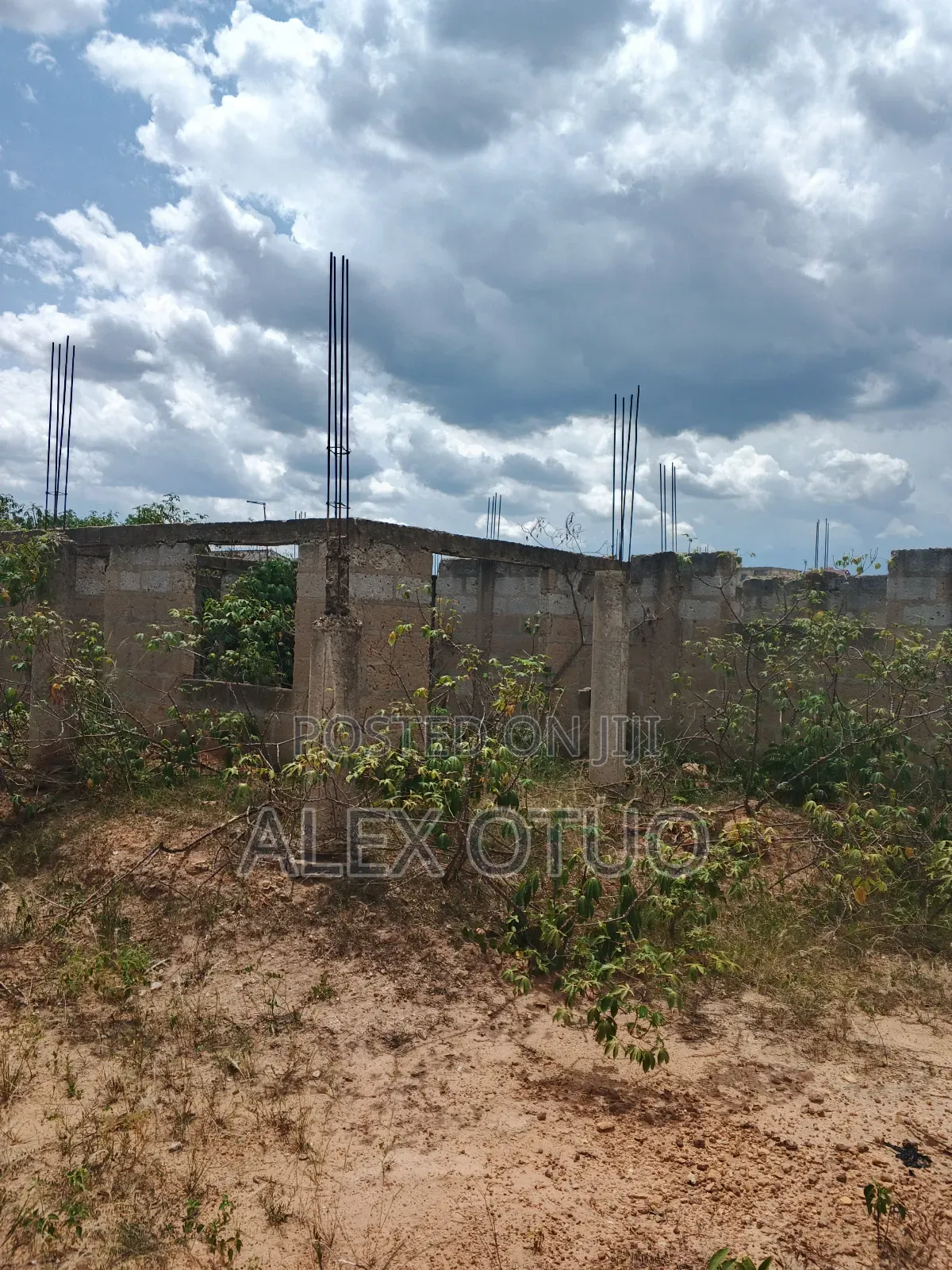 Uncompleted Building Building on Two Plots of Land