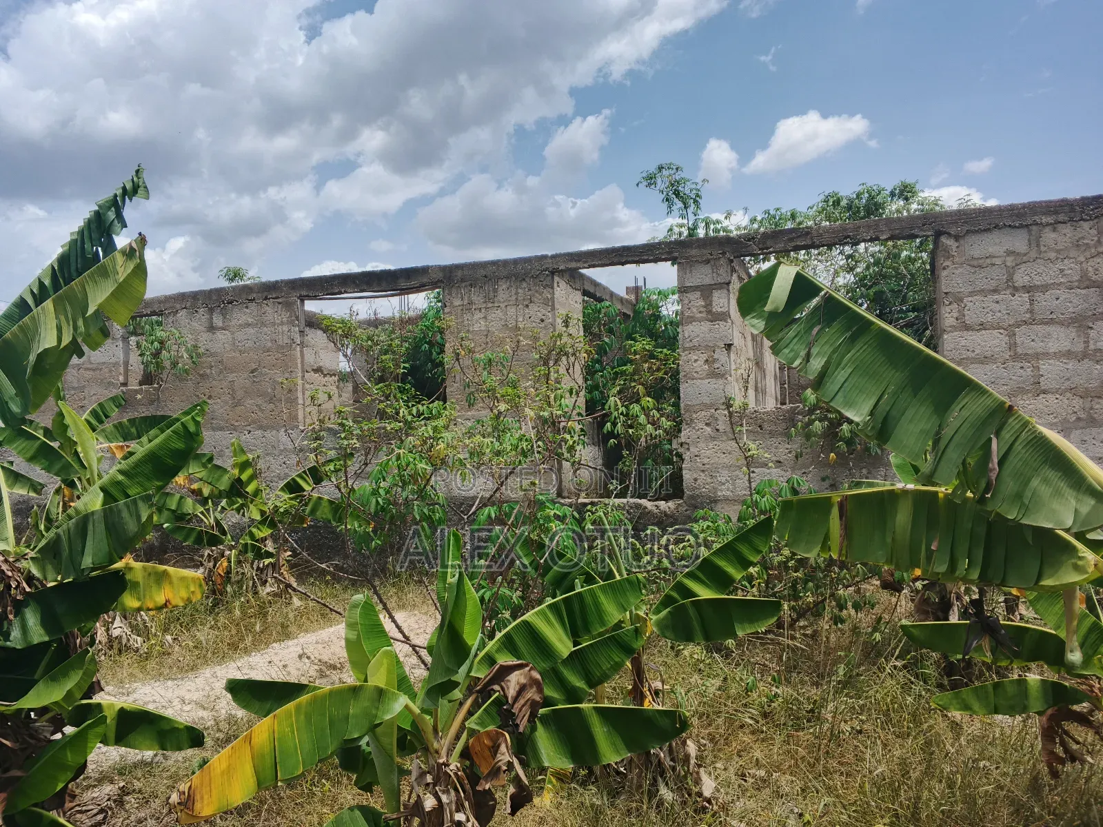 Uncompleted Building Building on Two Plots of Land