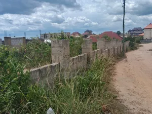 Uncompleted Building Building on Two Plots of Land