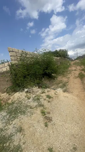 Wall and Gated 4 Plots of Land for Sale at Amasaman .
