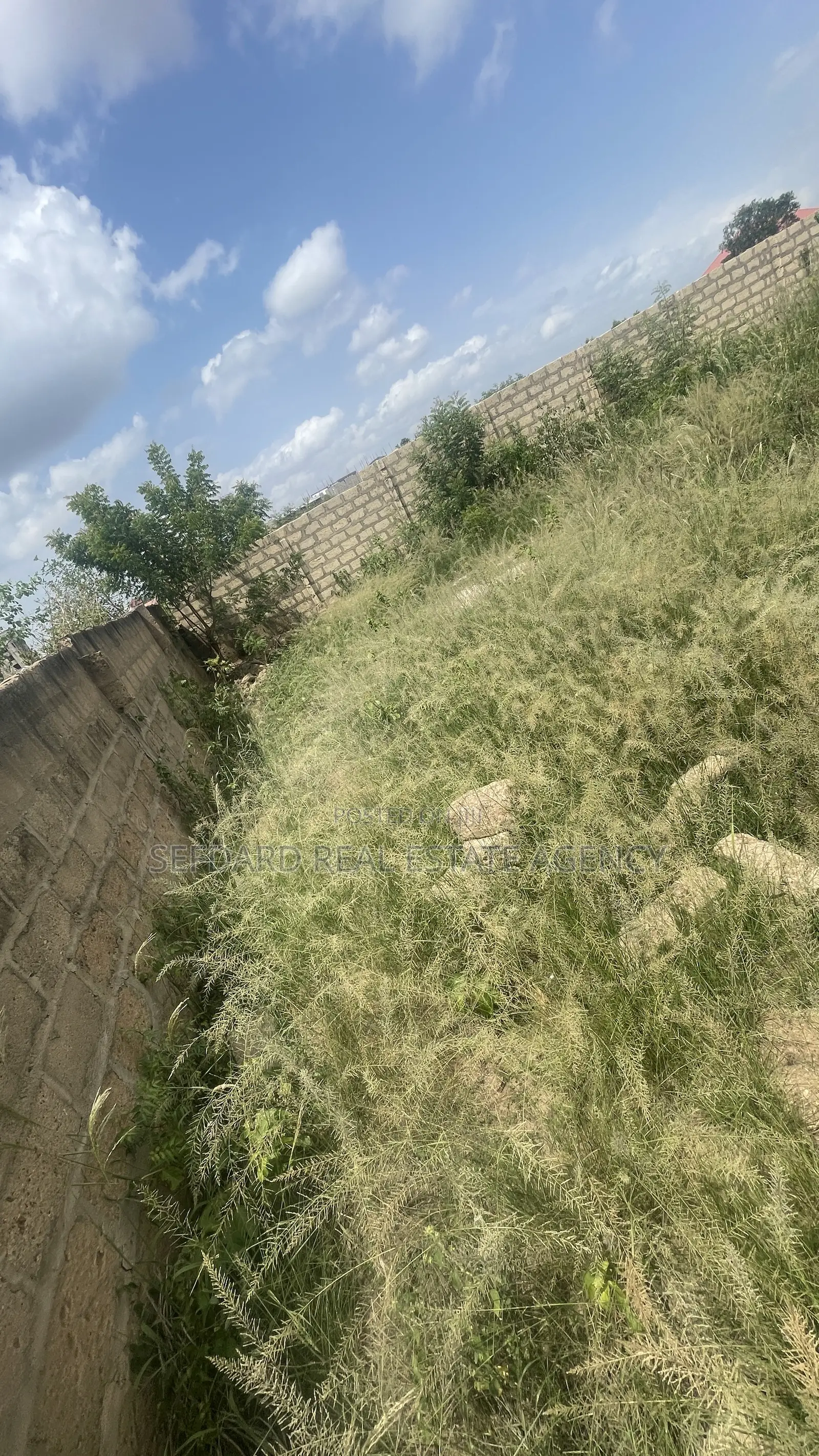 Wall and Gated 4 Plots of Land for Sale at Amasaman .