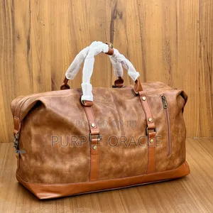 Photo - Brown and Black Leather Duffle Bag