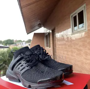 Nike Air Presto "Triple Black" Sneakers.