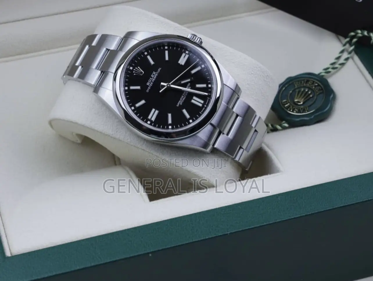 Rolex Oyster Perpetual Watch Red Dial.